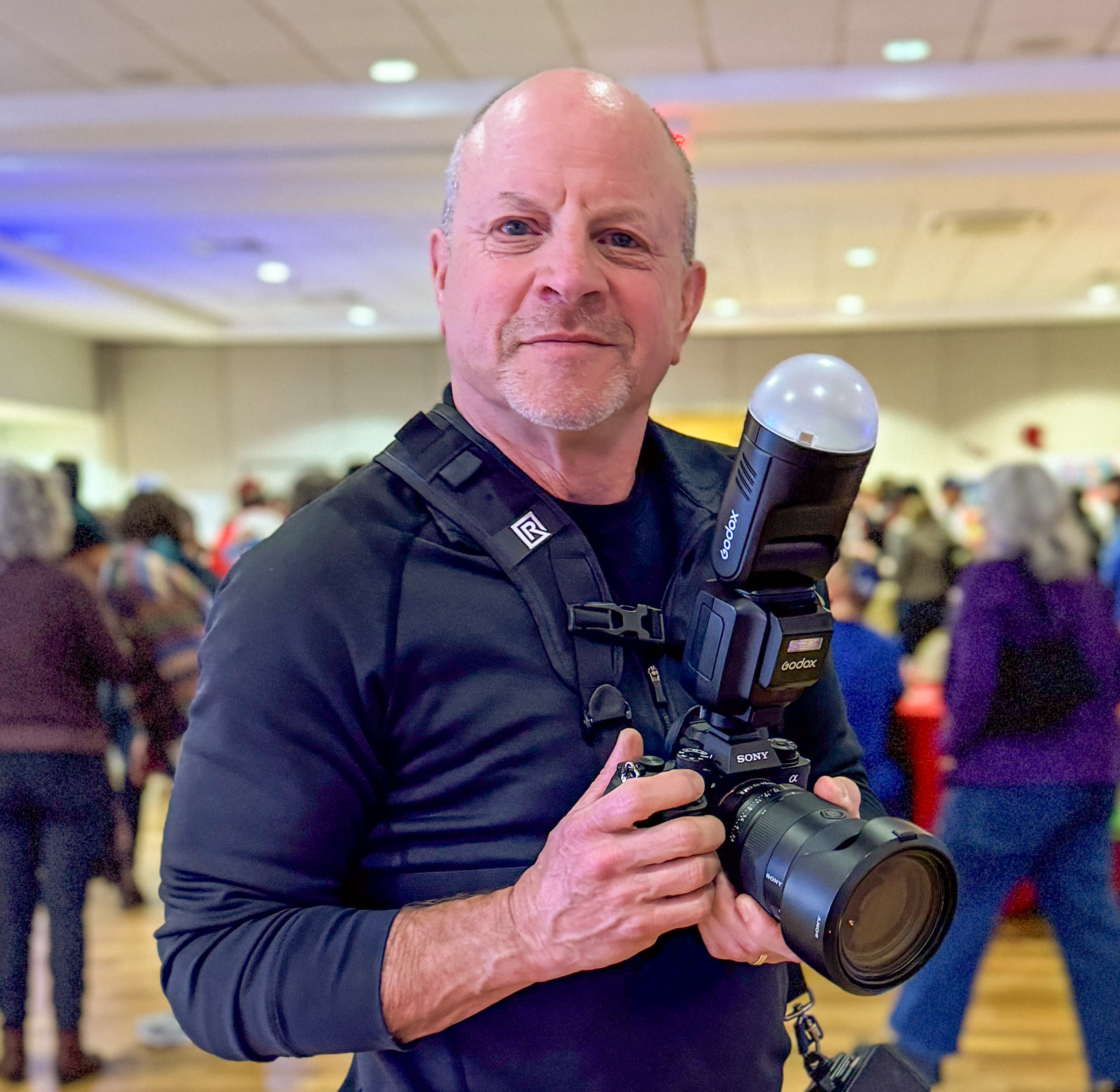 Picture of Steve Snyder photographing a celebration
